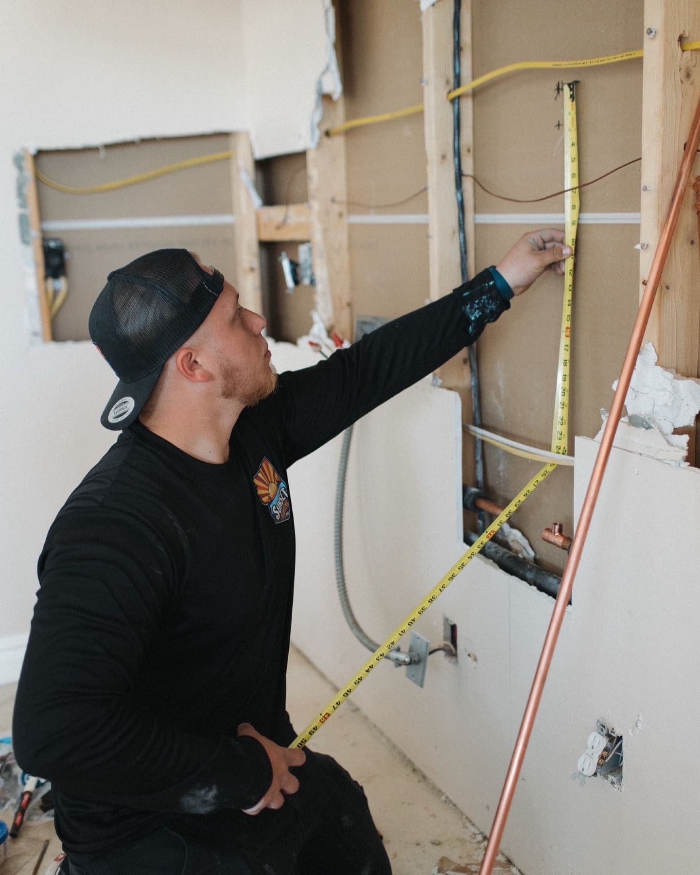 Sunset Home Services technician working on a home repipe in Gilbert, Arizona